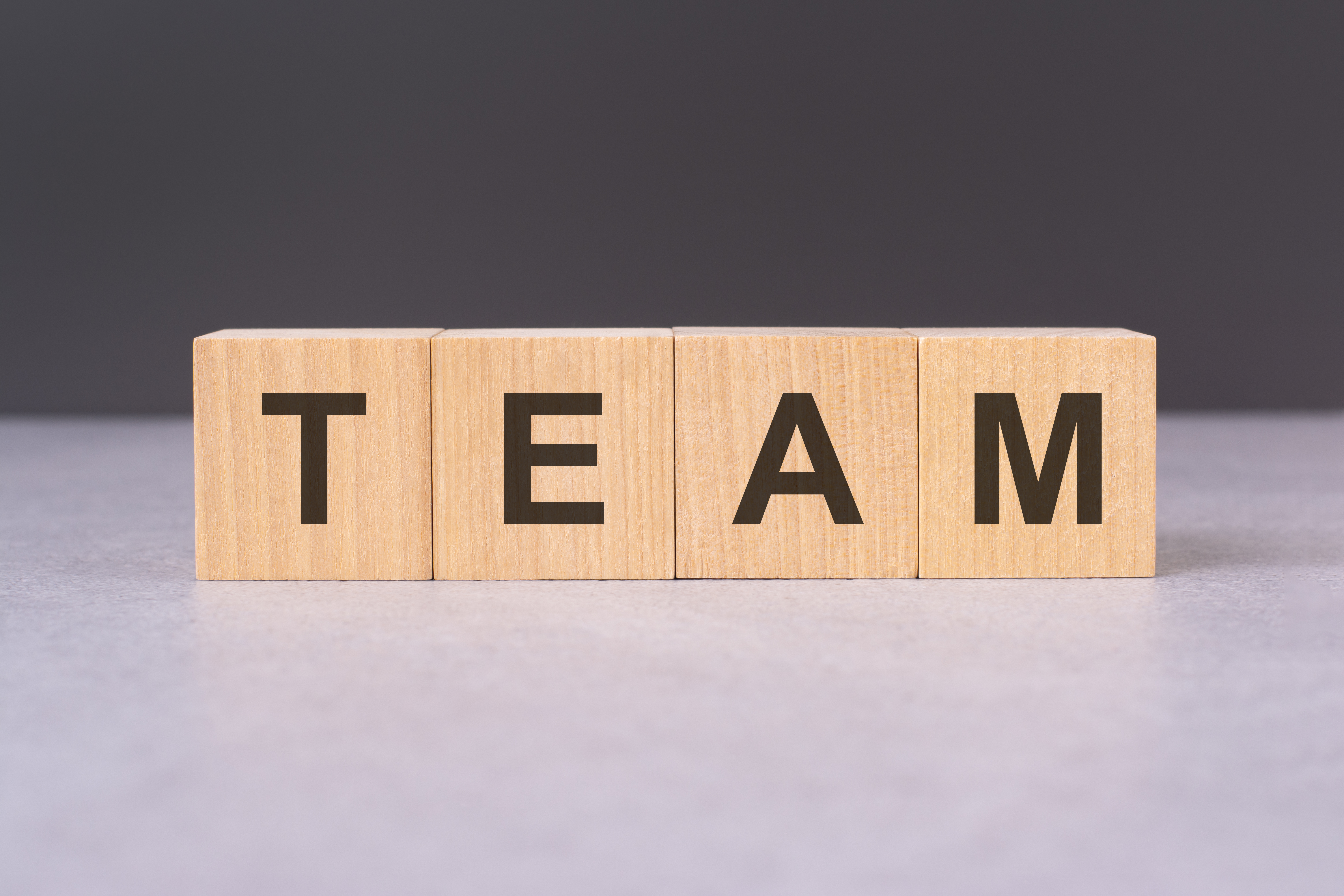 cubes form the word team concept emphasizing the significance of teamwork and collaboration symbolizing unity coordination and joint efforts towards common goals